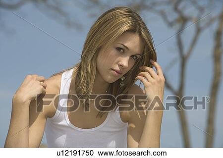 Woman sitting outside View Large Photo Image Stock Image - Woman sitting outside. Fotosearch