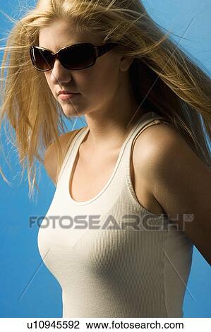 Woman wearing sunglasses View Large Photo Image Stock Image - Woman wearing sunglasses. Fotosearch
