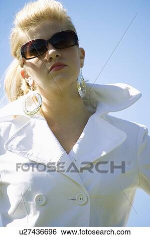 Woman wearing sunglasses View Large Photo Image Stock Photograph - Woman wearing sunglasses. Fotosearch
