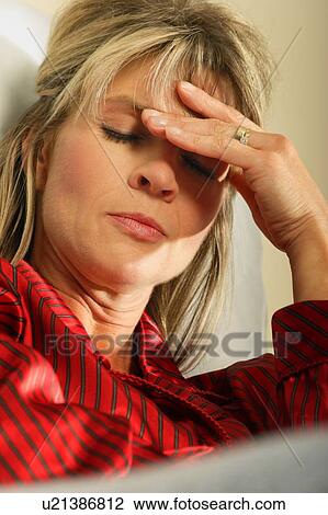 Woman with headache View Large Photo Image Stock Image - Woman with headache. Fotosearch