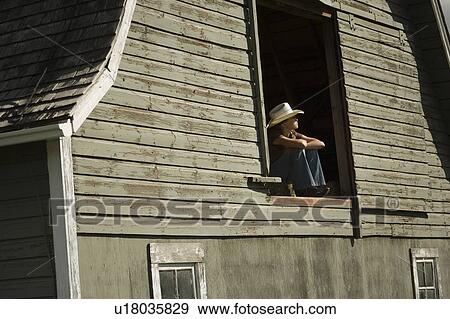 Young woman in barn loft View Large Photo Image Stock Photo - Young woman in barn loft. Fotosearch