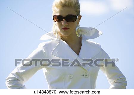 Female wearing sunglasses View Large Photo Image Stock Image - Female wearing sunglasses. Fotosearch