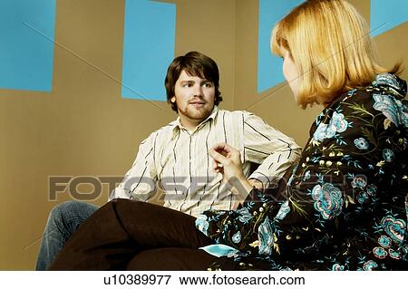 Stock Photo - Man and woman talking. Fotosearch