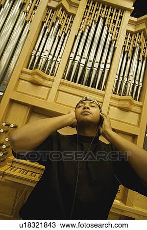 Man listening to music View Large Photo Image Stock Image - Man listening to music. Fotosearch