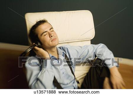 Stock Photo - Man relaxing after work. Fotosearch