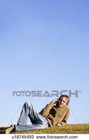 Stock Image - Man talking on cell phone. Fotosearch