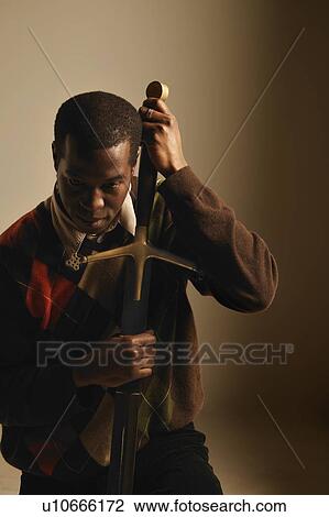 Man with sword View Large Photo Image Stock Image - Man with sword. Fotosearch