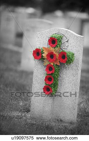 Poppy wreath on a gravestone View Large Photo Image Stock Photography - Poppy wreath on a gravestone. Fotosearch