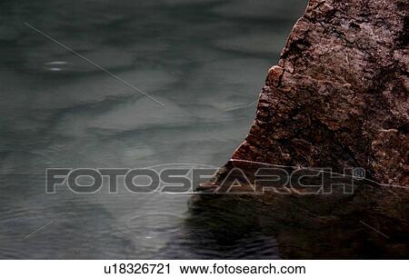 Rock in water View Large Photo Image Stock Image - Rock in water. Fotosearch