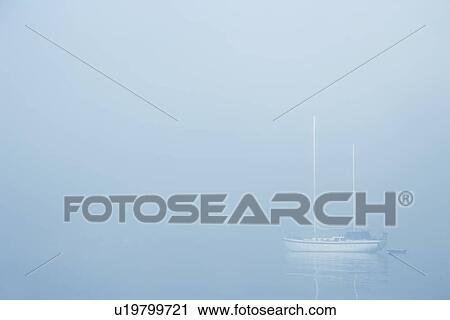 Sailboat in a fog View Large Photo Image Stock Image - Sailboat in a fog. Fotosearch