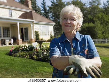 Senior woman gardening View Large Photo Image Stock Photo - Senior woman gardening. Fotosearch