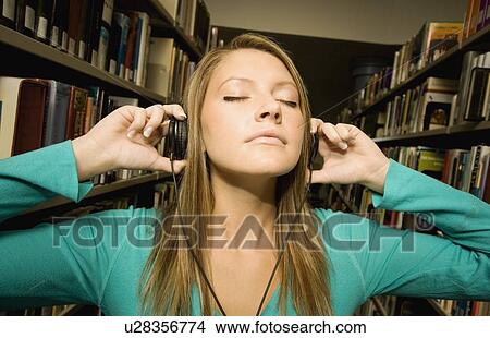 Student listening to music View Large Photo Image Picture - Student listening to music. Fotosearch