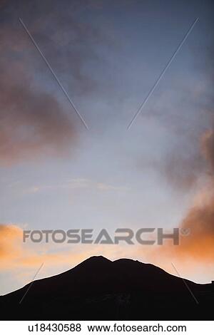 Sunset behind a hill View Large Photo Image Stock Photo - Sunset behind a hill. Fotosearch