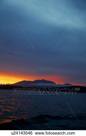 Sunset over mountain lake View Large Photo Image Stock Photograph - Sunset over mountain lake. Fotosearch