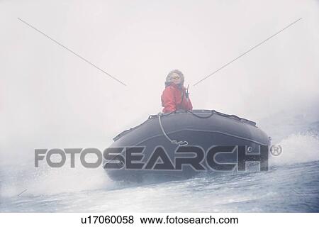 Woman riding a raft View Large Photo Image Stock Photo - Woman riding a raft. Fotosearch