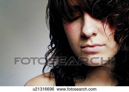 Woman with her eyes closed View Large Photo Image Stock Photograph - Woman with her eyes closed. Fotosearch