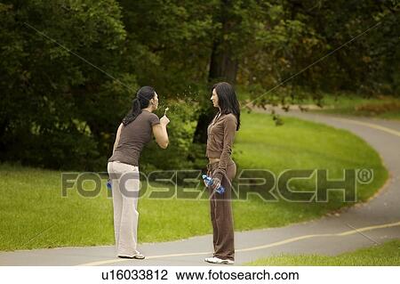 Stock Image - Women on a pathway. Fotosearch