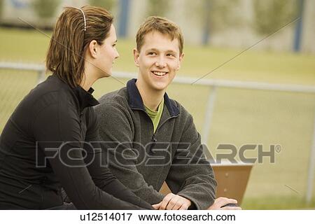 Young couple talking View Large Photo Image Stock Photo - Young couple talking. Fotosearch