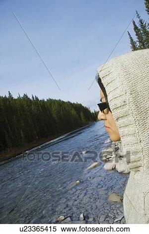 Young woman looking at river View Large Photo Image Stock Photography - Young woman looking at river. Fotosearch