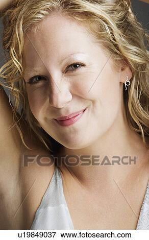 Stock Photo - young woman posing. Fotosearch