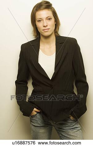 Stock Photograph - Young woman with suit coat. Fotosearch