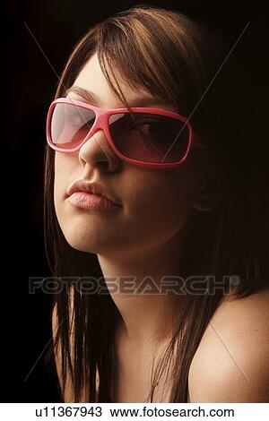 Young woman with sunglasses View Large Photo Image Stock Image - Young woman with sunglasses. Fotosearch