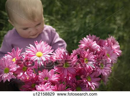 Stock Photo - Baby with flowers. Fotosearch