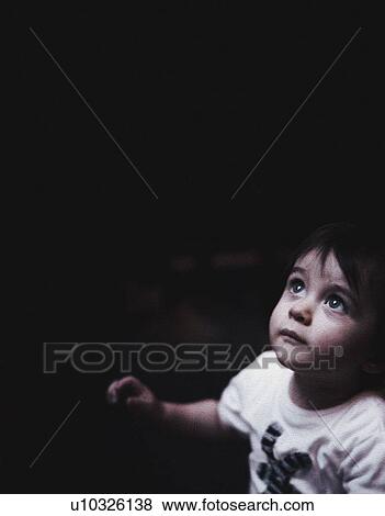 Boy looking up View Large Photo Image Stock Photo - Boy looking up. Fotosearch
