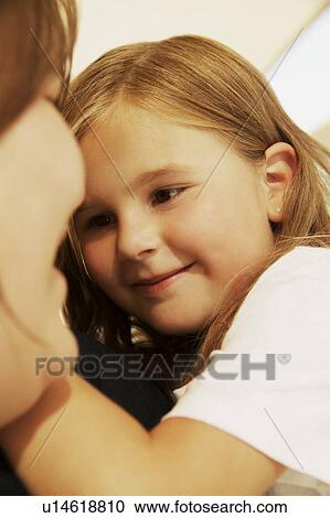 Child smiles at mother View Large Photo Image Stock Image - Child smiles at mother. Fotosearch