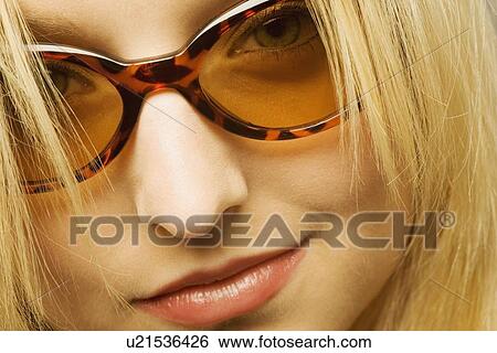 Stock Photograph - Close up of woman with sunglasses. Fotosearch