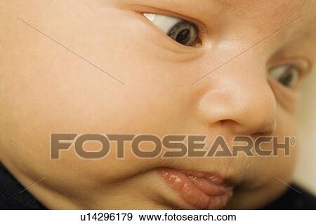 Stock Photo - Closeup of a baby's face. Fotosearch