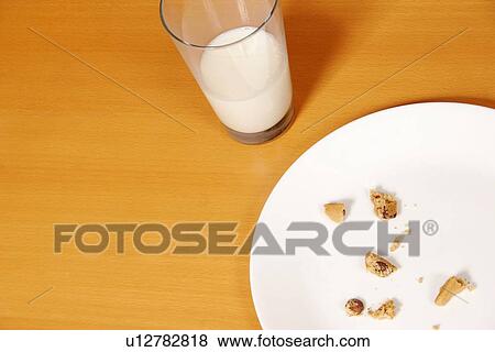 Cookies and a glass of milk View Large Photo Image Stock Photo - Cookies and a glass of milk. Fotosearch