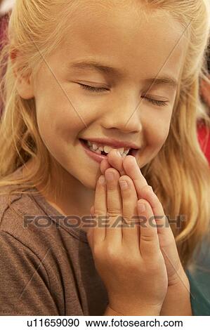 Stock Image - Girl praying. Fotosearch
