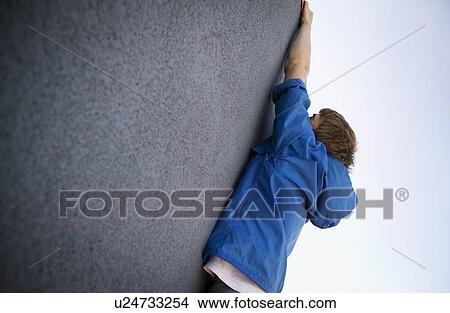 Picture - Man hanging on. Fotosearch