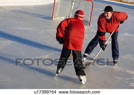 Playing hockey View Large Photo Image Picture - Playing hockey. Fotosearch