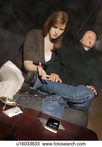 Stock Image - Pleading with a drug addict. Fotosearch