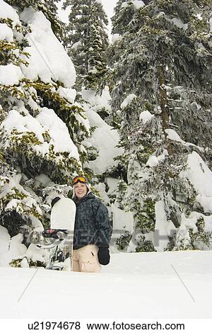 Portrait of a snowboarder in the snow View Large Photo Image Stock Photo - Portrait of a snowboarder in the snow. Fotosearch
