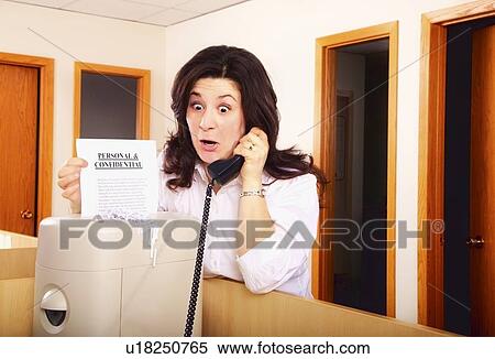 Stock Photography - Shredding personal documents. Fotosearch