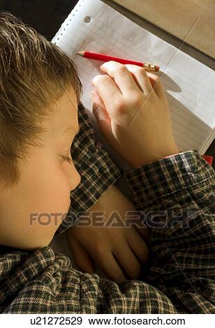 Stock Photo - Student asleep on his notebook. Fotosearch