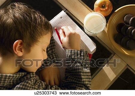 Student falls asleep on his notebook View Large Photo Image Stock Image - Student falls asleep on his notebook. Fotosearch