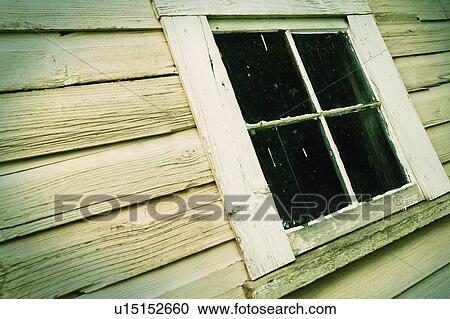 Stock Image - Window of a wooden building. Fotosearch