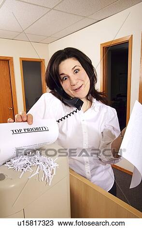 Stock Image - Woman distracted on the phone. Fotosearch