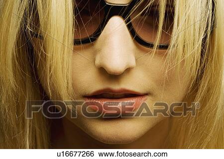 Stock Photograph - Woman with sunglasses. Fotosearch