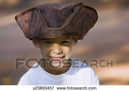 Young boy wearing a pirate hat View Large Photo Image Stock Photo - Young boy wearing a pirate hat. Fotosearch