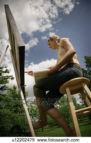 Artist painting on canvas View Large Photo Image Stock Photo - Artist painting on canvas. Fotosearch