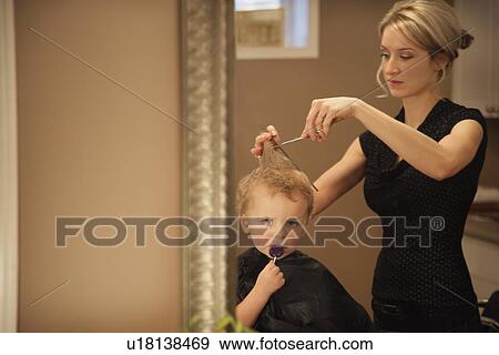 Boy getting a haircut View Large Photo Image Stock Photo - Boy getting a haircut. Fotosearch