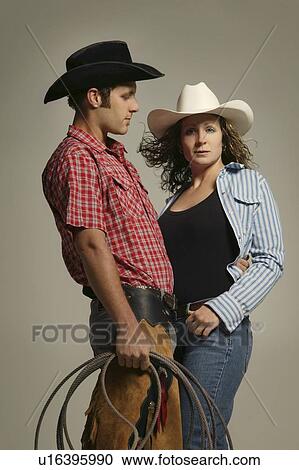 Stock Image - Couple wearing western clothing. Fotosearch