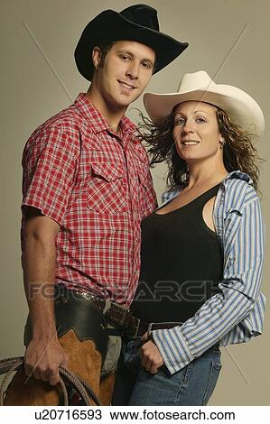 Stock Image - Couple wearing western clothing. Fotosearch