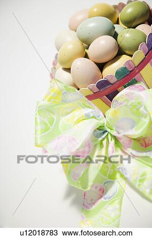 Easter eggs in a basket View Large Photo Image Stock Image - Easter eggs in a basket. Fotosearch