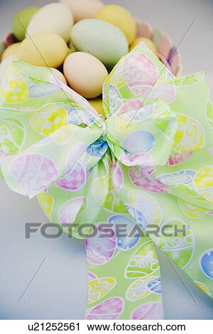 Easter eggs in a basket with bow View Large Photo Image Stock Image - Easter eggs in a basket with bow. Fotosearch